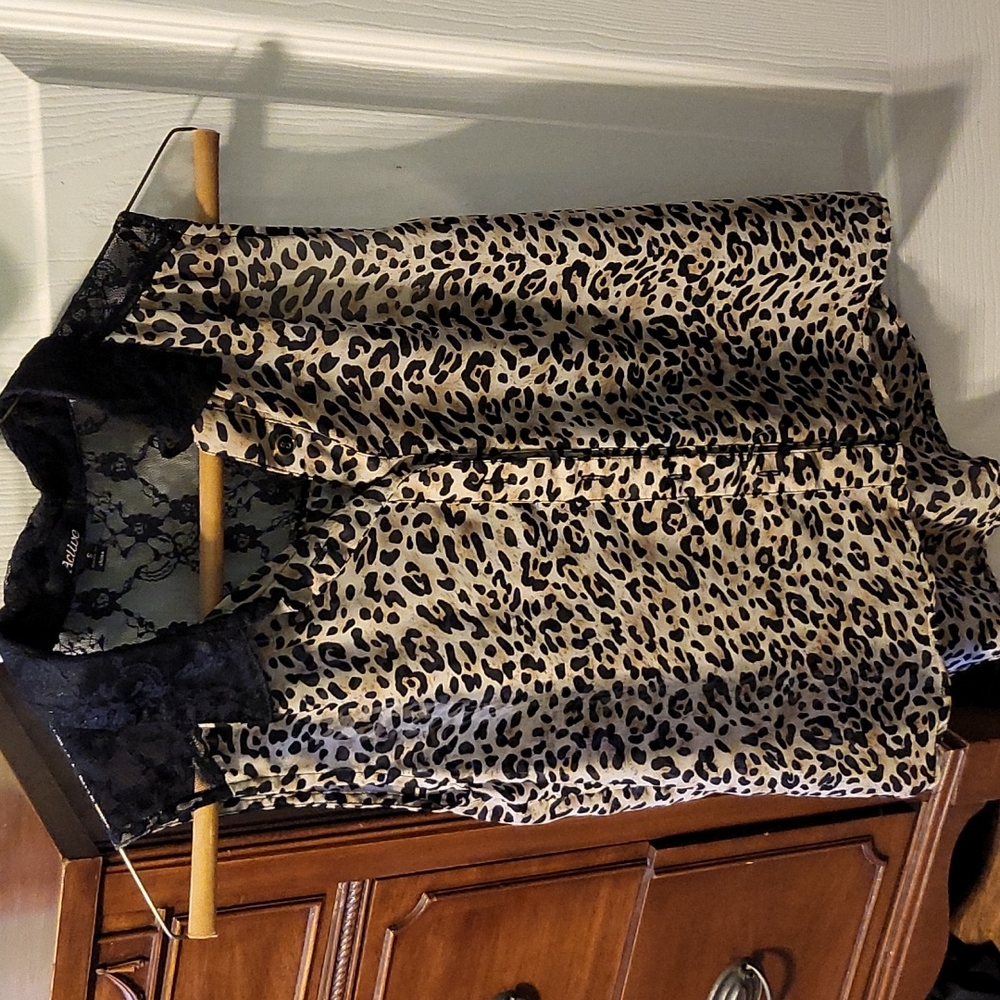 Jr size small. Leopard print button down shirt. Black see through lace on top.